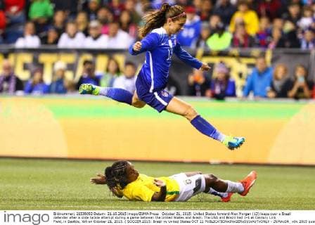 October 21, 2015: United States forward Alex Morgan (13) leaps over a Brazil defender after a slide tackle attempt during a game between the United States and Brazil. The USA and Brazil tied 1-1 at Century Link Field, in Seattle, WA on October 21, 2015. ( SOCCER 2015: Brazil vs United States OCT 21 - ZUMAc04_