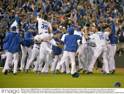 Kansas City Royals Eric Hosmer (35) jumps into the mass of Royals celebrating on the field after defeating the Toronto Blue Jays in the ALCS game 6 at Kaufman Stadium in Kansas City on October 23, 2015. Kansas City beats Toronto 4-3 to win the 2015 ALCS.  KCP2015102370 KEVINxDIETSCH