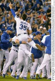 Kansas City Royals Eric Hosmer (35) jumps into the mass of Royals celebrating on the field after defeating the Toronto Blue Jays in the ALCS game 6 at Kaufman Stadium in Kansas City on October 23, 2015. Kansas City beats Toronto 4-3 to win the 2015 ALCS.  KCP2015102373 KEVINxDIETSCH