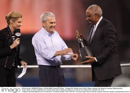 Kansas City Royals owner David Glass receives the American League Championship trophy after his team defeated the Toronto Blue Jays at Kauffman Stadium in Kansas City, Missouri on October 23, 2015.  KCP20151023507 JEFFxMOFFETT