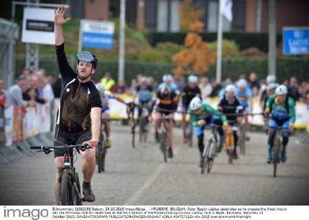 - KRUIBEKE, BELGIUM: Actor Begijn Leblue celebrates as he crosses the finish line to win the BV-cross race for celebrities at the third edition of the Poldercross cyclocross cycling race in Bazel, Kruibeke, Saturday 24 October 2015. DAVIDxSTOCKMAN  x04727122x