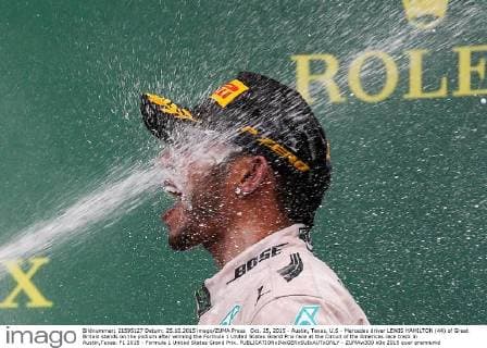 Oct. 25, 2015 - Austin, Texas, U.S - Mercedes driver LEWIS HAMILTON (44) of Great Britain stands on the podium after winning the Formula 1 United States Grand Prix race at the Circuit of the Americas race track in Austin,Texas. F1 2015 - Formula 1 United States Grand Prix. - ZUMAw300