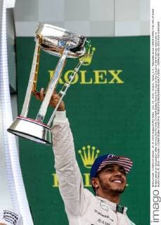 Oct. 25, 2015 - Austin, Texas, U.S - Mercedes driver LEWIS HAMILTON (44) of Great Britain stands on the podium after winning the Formula 1 United States Grand Prix race at the Circuit of the Americas race track in Austin,Texas. F1 2015 - Formula 1 United States Grand Prix. - ZUMAw300