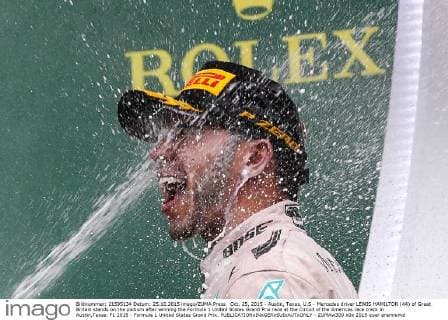 Oct. 25, 2015 - Austin, Texas, U.S - Mercedes driver LEWIS HAMILTON (44) of Great Britain stands on the podium after winning the Formula 1 United States Grand Prix race at the Circuit of the Americas race track in Austin,Texas. F1 2015 - Formula 1 United States Grand Prix. - ZUMAw300