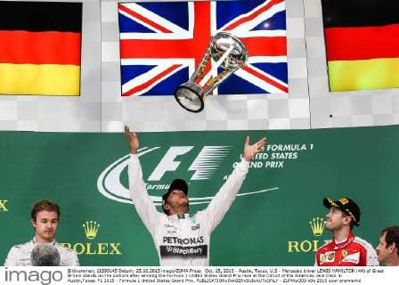 Oct. 25, 2015 - Austin, Texas, U.S - Mercedes driver LEWIS HAMILTON (44) of Great Britain stands on the podium after winning the Formula 1 United States Grand Prix race at the Circuit of the Americas race track in Austin,Texas. F1 2015 - Formula 1 United States Grand Prix. - ZUMAw300
