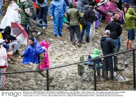 Oct. 25, 2015 - Austin, Texas, U.S - Fans watch and wade thru the mud after torrential rains turn the fields into mud during the Formula 1 United States Grand Prix race at the Circuit of the Americas race track in Austin,Texas. F1 2015 - Formula 1 United States Grand Prix. - ZUMAw300