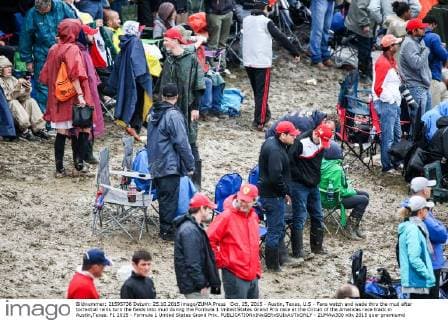 Oct. 25, 2015 - Austin, Texas, U.S - Fans watch and wade thru the mud after torrential rains turn the fields into mud during the Formula 1 United States Grand Prix race at the Circuit of the Americas race track in Austin,Texas. F1 2015 - Formula 1 United States Grand Prix. - ZUMAw300