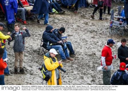 Oct. 25, 2015 - Austin, Texas, U.S - Fans watch and wade thru the mud after torrential rains turn the fields into mud during the Formula 1 United States Grand Prix race at the Circuit of the Americas race track in Austin,Texas. F1 2015 - Formula 1 United States Grand Prix. - ZUMAw300