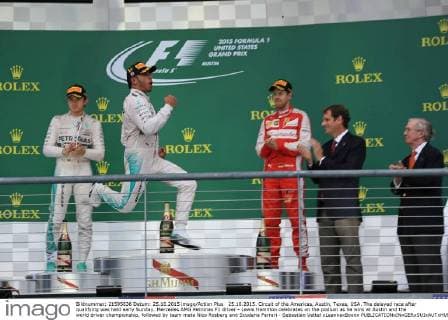 25.10.2015. Circuit of the Americas, Austin, Texas, USA. The delayed race after qualifying was held early Sunday. Mercedes AMG Petronas F1 driver - Lewis Hamilton celebrates on the podium as he wins at Austin and the world driver championship, followed by team mate Nico Rosberg and Scuderia Ferrari - Sebastian Vettel xLeannexBoonx  ActionPlus11675935