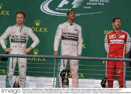 25.10.2015. Circuit of the Americas, Austin, Texas, USA. The delayed race after qualifying was held early Sunday. Mercedes AMG Petronas F1 driver - Lewis Hamilton Lewis Hamilton celebrates on the podium as he wins at Austin and the world driver championship followed by team mate Nico Rosberg and Scuderia Ferrari - Sebastian Vettel xLeannexBoonx  ActionPlus11675938