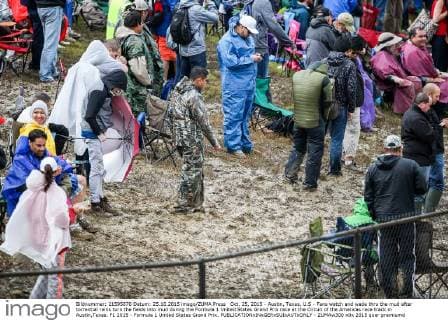 Oct. 25, 2015 - Austin, Texas, U.S - Fans watch and wade thru the mud after torrential rains turn the fields into mud during the Formula 1 United States Grand Prix race at the Circuit of the Americas race track in Austin,Texas. F1 2015 - Formula 1 United States Grand Prix. - ZUMAw300