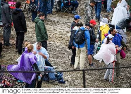 Oct. 25, 2015 - Austin, Texas, U.S - Fans watch and wade thru the mud after torrential rains turn the fields into mud during the Formula 1 United States Grand Prix race at the Circuit of the Americas race track in Austin,Texas. F1 2015 - Formula 1 United States Grand Prix. - ZUMAw300