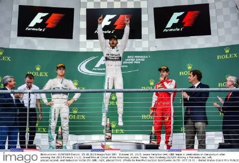 October 25, 2015: Lewis Hamilton (44) GBR leaps in celebration on the podium after winning the 2015 Formula 1 U.S. Grand Prix at Circuit of the Americas, Austin, Texas. Nico Rosberg (6) GER driving a Mercedes car, left, placed second, and Sebastian Vettel (5) GER, right, placed third. (Photo by Ken Murray Icon Sportswire) AUTO: OCT 25 F1 - United States Grand Prix Icon1510252940 EDITORIAL USE ONLY