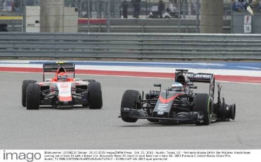Oct. 25, 2015 - Austin, Texas, US - Fernando Alonso 14 for the McLaren Honda team coming out of turn 16 with a blown tire. Alexander Rossi 53 ready to over take him in turn 16. 2015 Formula 1 United States Grand Prix Austin, Tx - ZUMAm147