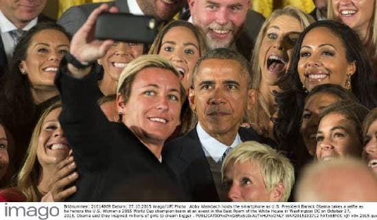 Abby Wambach holds the smartphone as U.S. President Barack Obama takes a selfie as he honors the U.S. Women s 2015 World Cup champion team at an event in the East Room of the White House in Washington DC on October 27, 2015. Obama said they inspired millions of girls to dream bigger .  WAP2015102712 PATxBENIC