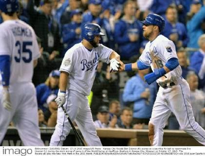 Kansas City Royals Ben Zobrist (R) scores on a sacrifice fly ball by teammate Eric Hosmer (L) during the sixth inning of game 1 of the World Series at Kauffman Stadium in Kansas City, Missouri on October 27, 2015. The Royals will play the New York Mets in the 2015 World.  KCP2015102729 KEVINxDIETSCH