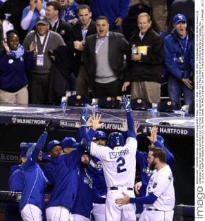 Oct. 27, 2015 - Kansas City, MO, USA - The Kansas City Royals Alcides Escobar (2) celebrates hitting an inside the park home run in the first inning against the New York Mets in Game 1 of the World Series on Tuesday, Oct. 27, 2015, at Kauffman Stadium in Kansas City, Mo. World Series, NY Mets at Kansas City, Game 1 - ZUMAm67_