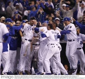 The Kansas City Royals celebrate after winning in the14th inning of game 1 of the World Series against the New York Mets at Kauffman Stadium in Kansas City, Missouri on October 27, 2015. Royals Eric Hosmer sacrificed in Alcides Escobar to beat the Mets 5-4.  KCP20151027245 JEFFxMOFFETT