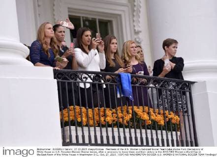 Members of the U.S. Women s National Soccer Team take photos from the balcony of White House as U.S. President Barack Obama leaves, after a ceremony to honor them and their victory in the 2015 FIFA Women s World Cup at the East Room of the White House in Washington D.C., Oct. 27, 2015. ) (SP)-US-WASHINGTON-SOCCER-U.S. WOMEN S NATIONAL SOCCER TEAM YinxBogu 
