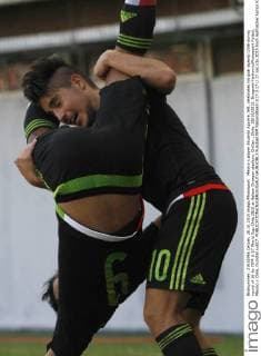 Mexico s player Eduardo Aguirre, left, celebrates his goal against Chile during round of 16 for FIFA U-17 World Cup Chile 2015 at Nelson Oyarzun stadium. Chillan , Chile. 28 10 2015. DragomirYankovicxPhotosport Futbol, Mexico v Chile, mundial sub17. 