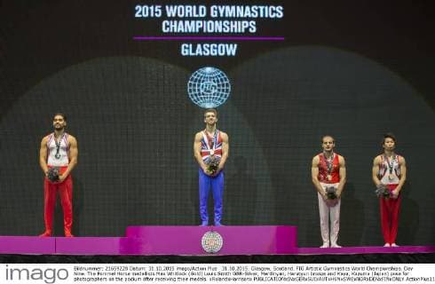 31.10.2015. Glasgow, Scotland. FIG Artistic Gymnastics World Championships. Day Nine. The Pommel Horse medallists Max Whitlock (Gold) Louis Smith GBR-Silver, Merdinyan, Harutyun bronze and Kaya, Kazuma (Japan) pose for photographers on the podium after receiving their medals. xRolandxHarrisonx  ActionPlus11677850