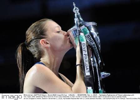 (151101) -- SINGAPORE, Nov. 1, 2015 -- Agnieszka Radwanska of Poland celebrates with her trophy after defeating Petra Kvitova of the Czech Republic in their women s singles finals tennis match of the WTA Tennis Damen Finals at the Singapore Indoor Stadium November 1, 2015. Agnieszka Radwanska won 2-1 and claimed the title.) (SP)SINGAPORE-WTA-FINALS ThenxChihxWey 