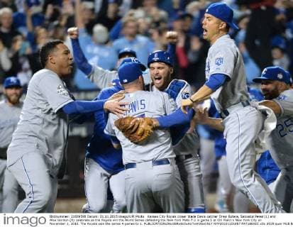 Kansas City Royals closer Wade Davis catcher Drew Butera, Salvador Perez (L) and Alex Gordon (R) celebrate as the Royals win the World Series defeating the New York Mets 7-2 in game 5 at Citi Field in New York City on November 1, 2015. The Royals won the series 4 games to 1.  NYP20151101857 PATxBENIC