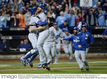 Kansas City Royals closer Wade Davis celebrates with catcher Drew Butera as the Royals win the World Series defeating the New York Mets 7-2 in game 5 at Citi Field in New York City on November 1, 2015. The Royals won the series 4 games to 1.  NYP20151101858 PATxBENIC