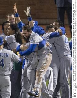 Kansas City Royals first baseman Eric Hosmer (35) and third baseman Mike Moustakas (C) celebrate after they beat the New York Mets 7-2 to win the World Series in game 5 at Citi Field in New York City on November 1, 2015.  NYP20151101330 RAYxSTUBBLEBINE