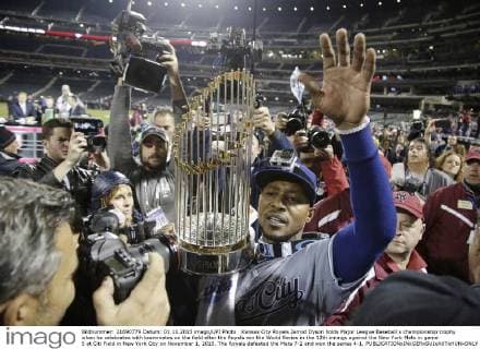 Kansas City Royals Jarrod Dyson holds Major League Baseball s championship trophy when he celebrates with teammates on the field after the Royals win the World Series in the 12th innings against the New York Mets in game 5 at Citi Field in New York City on November 1, 2015. The Royals defeated the Mets 7-2 and won the series 4-1.  NYP20151101179 JOHNxANGELILLO