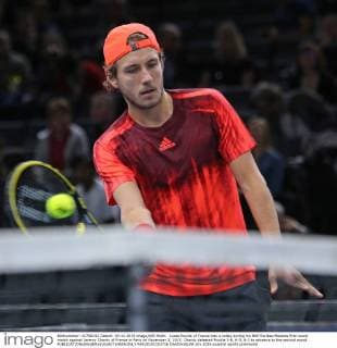 Lucas Pouille of France hits a volley during his BNP Paribas Masters first round match against Jeremy Chardy of France in Paris on November 3, 2015. Chardy defeated Pouille 3-6, 6-3, 6-2 to advance to the second round.  PAR20151103716 DAVIDxSILPA