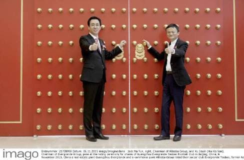 Jack Ma Yun, right, Chairman of Alibaba Group, and Xu Jiayin (Hui Ka Yan), Chairman of Evergrande Group, pose at the listing ceremony for shares of Guangzhou Evergrande Taobao Football Club in Beijing, China, 6 November 2015. China s real estate giant Guangzhou Evergrande and e-commerce giant Alibaba Group listed their soccer club Evergrande Taobao, former Asian Champions League winners, on Friday (6 November 2015) in what is a first for a football team in the region. Launched on the system National Equities Exchange and Quotations , the club was listed on China s so-called New Third Board for small enterprises. The listing of Evergrande Taobao will further strengthen its corporate governance structure and enhance the liquidity of its equity interest, thus facilitating the introduction of strategic investors, promotion of corporate image and realization of sustainable development,¡± Evergrande said earlier. Alibaba paid US$192 million for a stake in the club in 2014 while Guangzhou Evergrande owns 60 percent of the club. Evergrande, Alibaba list joint football club to become first in Asia  20151106_32303