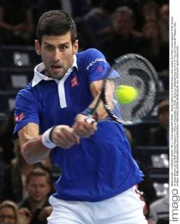 Novak Djokovic of Serbia hits a shot during his finals match against Andy Murray of Great Britain at the BNP Paribas Masters in Paris on November 8, 2015. Djokovic defeated Murray 6-2, 6-4 to win his fourth Masters title in Paris.  PAR20151108709 DAVIDxSILPA
