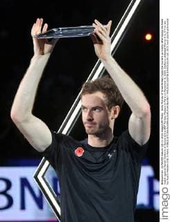Andy Murray of Great Britain holds the runners up trophy after losing his finals match against Novak Djokovic of Serbia at the BNP Paribas Masters in Paris on November 8, 2015. Djokovic defeated Murray 6-2, 6-4 to win his fourth Masters title in Paris.  PAR20151108736 DAVIDxSILPA