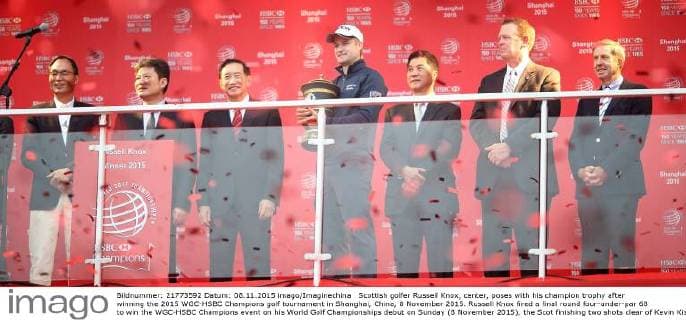 Scottish golfer Russell Knox, center, poses with his champion trophy after winning the 2015 WGC-HSBC Champions golf tournament in Shanghai, China, 8 November 2015. Russell Knox fired a final round four-under-par 68 to win the WGC-HSBC Champions event on his World Golf Championships debut on Sunday (8 November 2015), the Scot finishing two shots clear of Kevin Kisner at the Sheshan International Golf Club. The only player not to complete his third round in fading light on Saturday, Knox returned to the course early on Sunday and birdied the par-five 18th to join American Kisner at the top of the leaderboard after 54 holes. The 30-year-old then used some supreme wedge play to offset two bogeys with six birdies on his way to a 20-under 268 total to become the first Scot to win a WGC event and also the first debutant to claim victory since Jeff Maggert in 1999. Knox springs Shanghai surprise for maiden WGC win  pbu358008_61