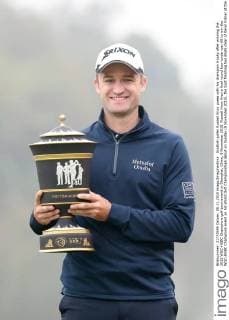 Scottish golfer Russell Knox poses with his champion trophy after winning the 2015 WGC-HSBC Champions golf tournament in Shanghai, China, 8 November 2015. Russell Knox fired a final round four-under-par 68 to win the WGC-HSBC Champions event on his World Golf Championships debut on Sunday (8 November 2015), the Scot finishing two shots clear of Kevin Kisner at the Sheshan International Golf Club. The only player not to complete his third round in fading light on Saturday, Knox returned to the course early on Sunday and birdied the par-five 18th to join American Kisner at the top of the leaderboard after 54 holes. The 30-year-old then used some supreme wedge play to offset two bogeys with six birdies on his way to a 20-under 268 total to become the first Scot to win a WGC event and also the first debutant to claim victory since Jeff Maggert in 1999. Knox springs Shanghai surprise for maiden WGC win  pbu358008_68
