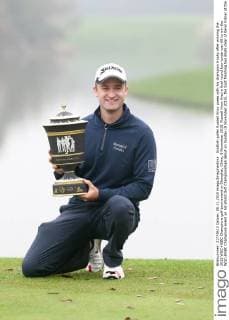 Scottish golfer Russell Knox poses with his champion trophy after winning the 2015 WGC-HSBC Champions golf tournament in Shanghai, China, 8 November 2015. Russell Knox fired a final round four-under-par 68 to win the WGC-HSBC Champions event on his World Golf Championships debut on Sunday (8 November 2015), the Scot finishing two shots clear of Kevin Kisner at the Sheshan International Golf Club. The only player not to complete his third round in fading light on Saturday, Knox returned to the course early on Sunday and birdied the par-five 18th to join American Kisner at the top of the leaderboard after 54 holes. The 30-year-old then used some supreme wedge play to offset two bogeys with six birdies on his way to a 20-under 268 total to become the first Scot to win a WGC event and also the first debutant to claim victory since Jeff Maggert in 1999. Knox springs Shanghai surprise for maiden WGC win  pbu358008_97