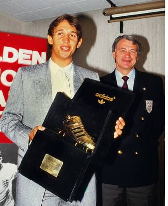 Football - 1986 Adidas Golden boot Award England s Gary Lineker receives the Adidas Golden boot Award from England team Manager Bobby Robson for most goals scored in the World Cup in Mexico 