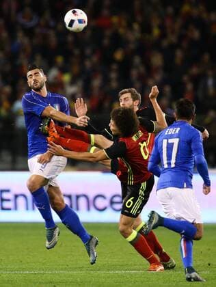 - BRUSSELS, BELGIUM: Italy s Graziano Pelle, Belgium s Nicolas Lombaerts and Belgium s Axel Witsel fight for the ball during a friendly soccer game between Belgian national team Nationalteam Red Devils and Italy, in Brussels, Friday 13 November 2015, a game in preparation of the Euro2016 European Championship EM Europameisterschaft VIRGINIExLEFOUR  x04739669x