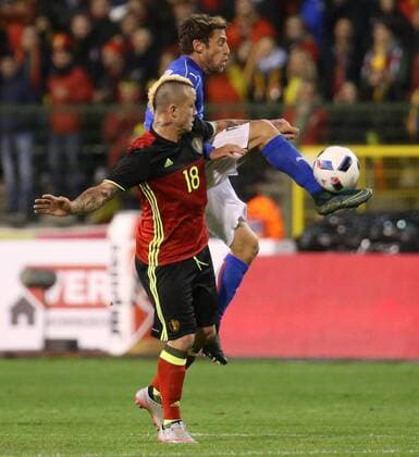 - BRUSSELS, BELGIUM: Belgium s Radja Nainggolan and Italy s Claudio Marchisio fight for the ball during a friendly soccer game between Belgian national team Nationalteam Red Devils and Italy, in Brussels, Friday 13 November 2015, a game in preparation of the Euro2016 European Championship EM Europameisterschaft VIRGINIExLEFOUR  x04739841x