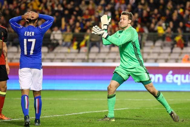 - BRUSSELS, BELGIUM: Belgium s goalkeeper Simon Mignolet celebrates during a friendly soccer game between Belgian national team Nationalteam Red Devils and Italy, in Brussels, Friday 13 November 2015, a game in preparation of the Euro2016 European Championship EM Europameisterschaft VIRGINIExLEFOUR  x04739848x