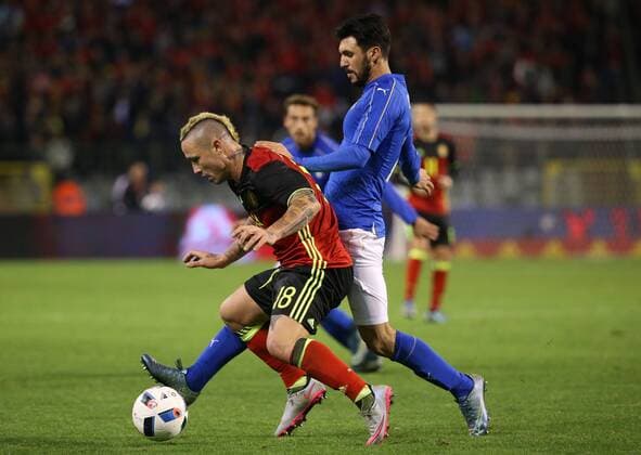 - BRUSSELS, BELGIUM: Belgium s Radja Nainggolan and Italy s Roberto Soriano fight for the ball during a friendly soccer game between Belgian national team Nationalteam Red Devils and Italy, in Brussels, Friday 13 November 2015, a game in preparation of the Euro2016 European Championship EM Europameisterschaft VIRGINIExLEFOUR  x04739877x