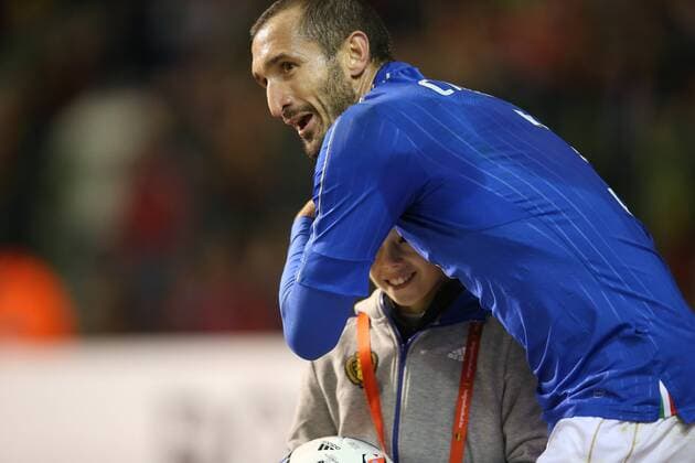 - BRUSSELS, BELGIUM: Italy s Giorgio Chiellini pictured with a ball boy during a friendly soccer game between Belgian national team Nationalteam Red Devils and Italy, in Brussels, Friday 13 November 2015, a game in preparation of the Euro2016 European Championship EM Europameisterschaft BRUNOxFAHY  x04739895x