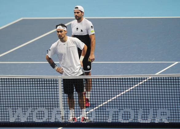 Tennis - 2015 ATP Tennis Herren World Tour Finals at The O2 - Day One Mens Doubles : Jamie Murray (GBR) and John Peers (AUS) vs. Simone Bolelli and Fabio Fognini (Italy) Simone Bolelli - behind and Fabio Fognini (Italy) COLORSPORT ANDREW COWIE 