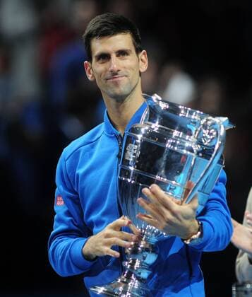 Tennis - 2015 ATP Tennis Herren World Tour Finals at The O2 - Day One Group : Stan Smith : Mens singles : Novak Djokovic (Serb) vs. Kai Nishikori (Jap) Novak Djokovic receives the Season s No 1 Ranking trophy COLORSPORT ANDREW COWIE 