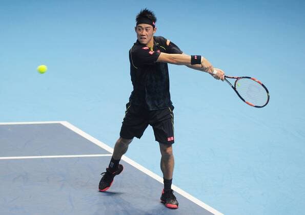 Tennis - 2015 ATP Tennis Herren World Tour Finals at The O2 - Day One Group : Stan Smith : Mens singles : Novak Djokovic (Serb) vs. Kai Nishikori (Jap) Kai Nishikori on his way to defeat COLORSPORT ANDREW COWIE 