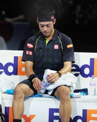 Tennis - 2015 ATP Tennis Herren World Tour Finals at The O2 - Day One Group : Stan Smith : Mens singles : Novak Djokovic (Serb) vs. Kai Nishikori (Jap) Kai Nishikori on his way to defeat COLORSPORT ANDREW COWIE 