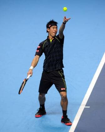 Tennis - 2015 ATP Tennis Herren World Tour Finals at The O2 - Day One Group : Stan Smith : Mens singles : Novak Djokovic (Serb) vs. Kai Nishikori (Jap) Kai Nishikori serving COLORSPORT ANDREW COWIE 