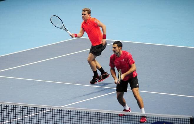 Tennis - 2015 ATP Tennis Herren World Tour Finals at The O2 - Day One Group Fleming McEnroe Doubles: Jean-Julien Rojer (France) & Horia Tecau (Romania) vs. Marcin Matkowski (Poland) & Nenad Zimonjic (Serbia) Marcin Matkowski (Poland) & Nenad Zimonjic (Serbia) COLORSPORT ANDREW COWIE 