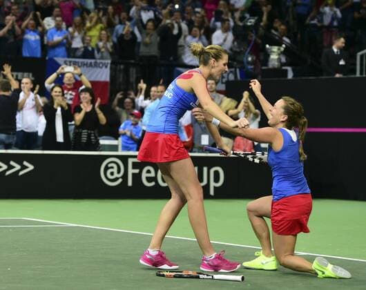 Czech Republic team players Barbora Strycova (right) and Karolina Pliskova celebrate after winning the Fed Cup tennis final match between Czech Republic and Russia in Prague, Czech Republic, November 15, 2015. Czech Republic beat Russia in tennis Fed Cup final 3-2 and defended title. (CTKxPhoto KamarytxMichal) CTKPhotoP201511150704401  KMT_8137
